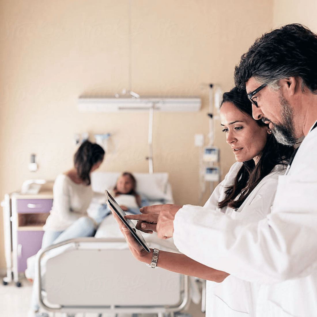 doctors looking at ipad doctors looking at ipad