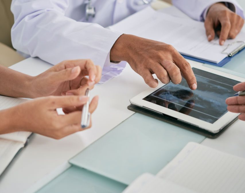 doctors looking at xray on ipad