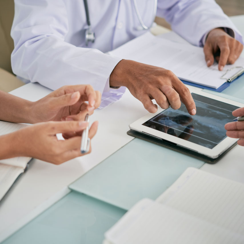 doctors looking at xray on ipad